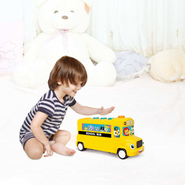 Close-up of musical school bus toy showing learning buttons