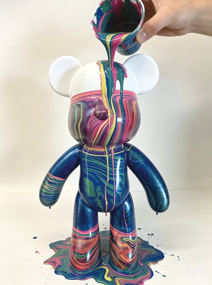 Child painting on ceramic vase with water