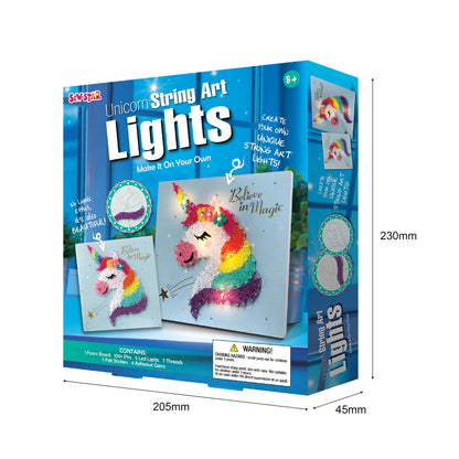 Child wrapping colorful strings around pins to create unicorn design